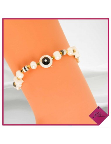 Bracelet élastiqué en acier doré, petites perles en nacre et perles fimo noires et blanches