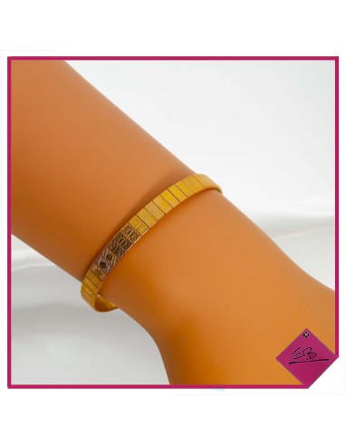 Bracelet semi rigide en métal rosé, fermoir clip, décor de petits ronds