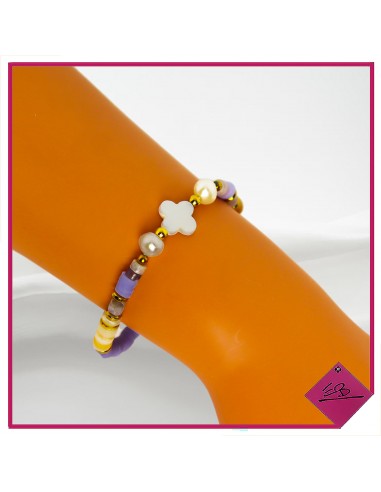 Bracelet élastiqué en acier doré, petites perles cylindriques en fimo lilas et nacre
